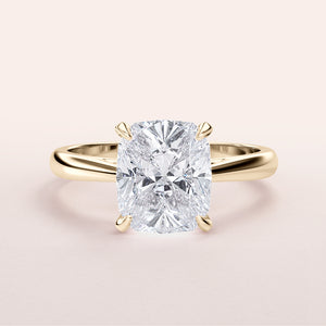 Elegant 14K/18K yellow gold cushion-cut diamond engagement ring, featuring a sparkling diamond in a classic cathedral setting.