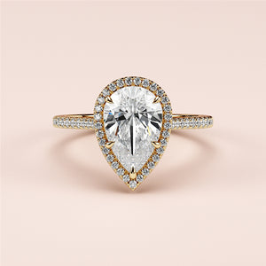 Elegant 14K and 18K gold pear-shaped diamond engagement ring with halo and pave band, perfect for your timeless romance.