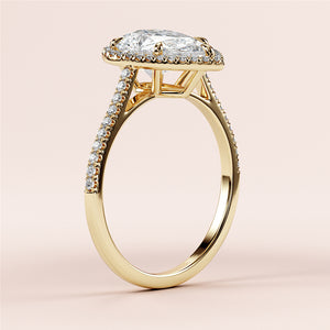 Elegant 14K/18K yellow gold engagement ring with pear-shaped halo, featuring a captivating diamond and intricate pave accents.