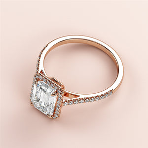 Elegant 14K Rose Gold engagement ring with Asscher-Cut diamond center, halo, and pave-set diamonds for special occasions.