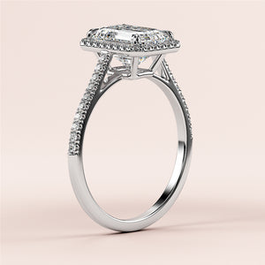 Elegant 14K white gold engagement ring with emerald halo, cathedral pave band, featuring radiant-cut diamond.