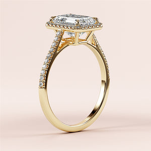 Elegant 14K yellow gold engagement ring featuring an emerald halo, cathedral setting, andPave diamonds along the band.