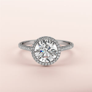 Exquisite round diamond engagement ring in white gold with a halo setting, available in 14K and 18K variants.