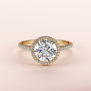 Elegant 14K/18K gold halo engagement ring with round brilliant diamond and sparkling pave band, showcasing timeless beauty.