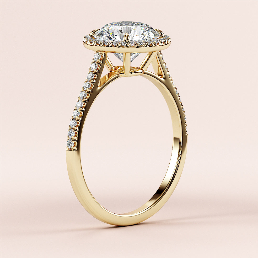 "Elegant 14K yellow gold engagement ring featuring a round halo design withPave diamond accents for a stunning sparkle."