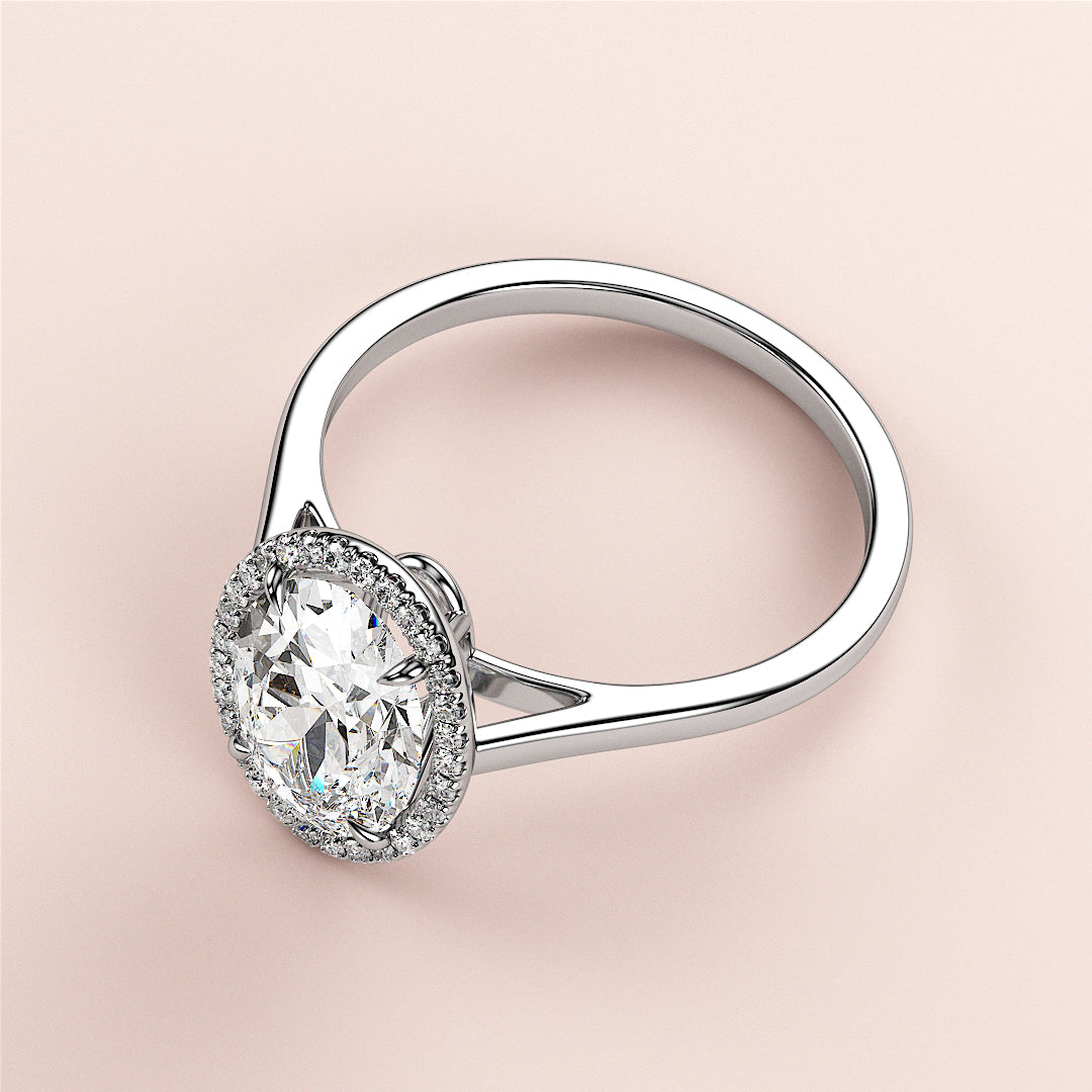 "Elegant oval halo engagement ring in 14K or 18K gold, featuring a dazzling diamond centerpiece and a radiant halo."|

#14KRecycledWhiteGold
#18KRecycledWhiteGold








#Platinum