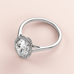 "Elegant oval halo engagement ring in 14K or 18K gold, featuring a dazzling diamond centerpiece and a radiant halo."