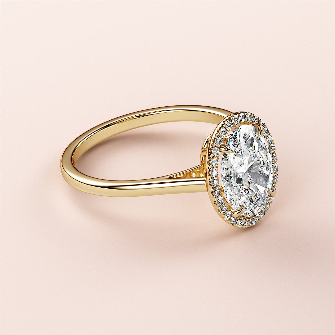 Elegant 14K/18K yellow gold oval halo engagement ring with central diamond andPave setting, perfect for a timeless proposal.|




#14KRecycledYellowGold
#18KRecycledYellowGold





