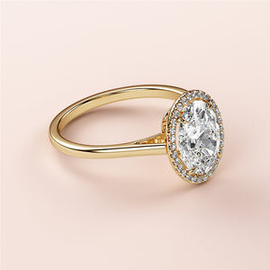 Elegant 14K/18K yellow gold oval halo engagement ring with central diamond andPave setting, perfect for a timeless proposal.