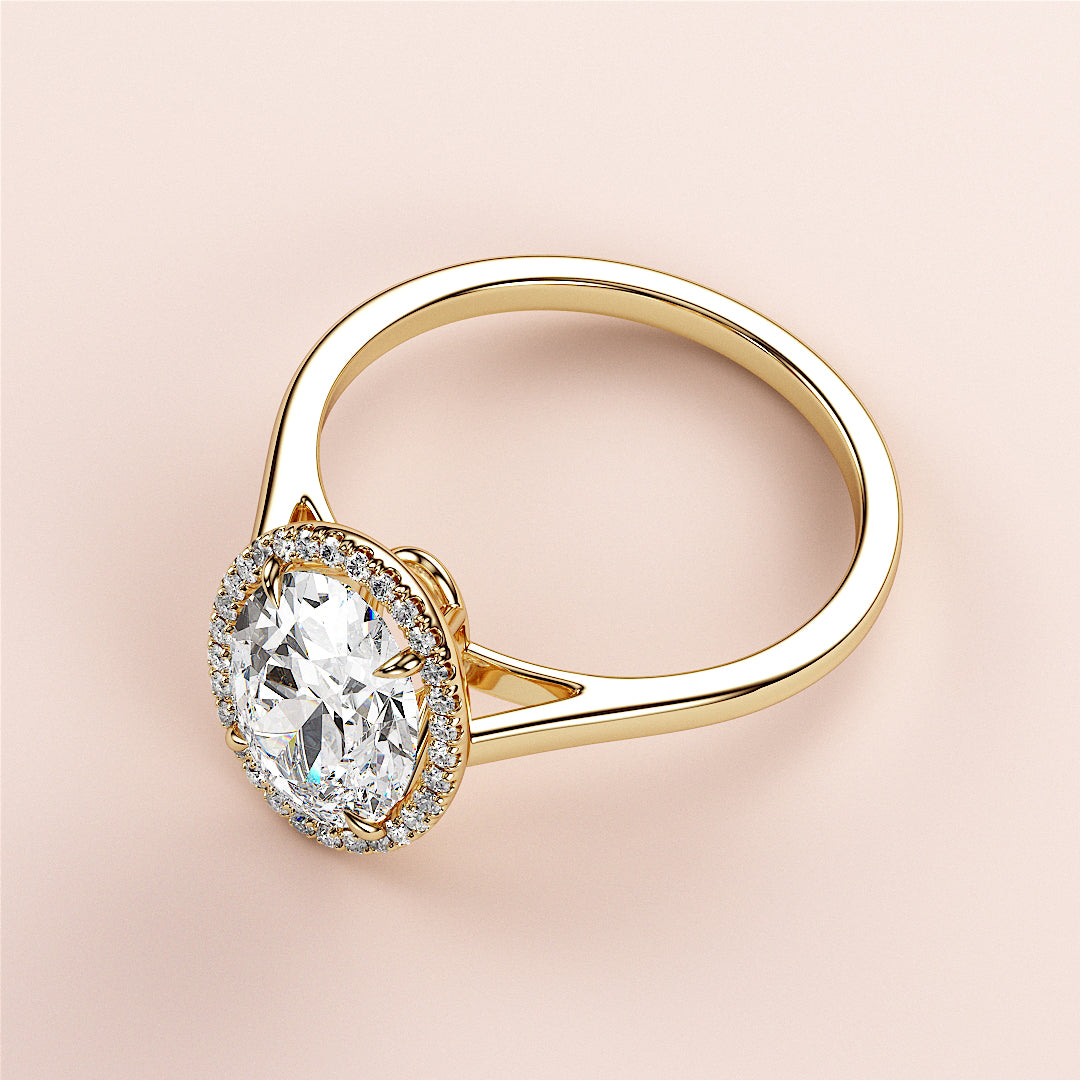 Elegant 14K yellow gold engagement ring featuring a halo setting with an oval diamond, perfect for special occasions.|




#14KRecycledYellowGold
#18KRecycledYellowGold





