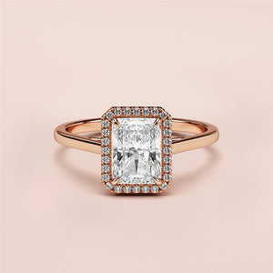 Radiant cut diamond halo engagement ring in 14K or 18K rose gold, featuring an elegant rectangular shape.