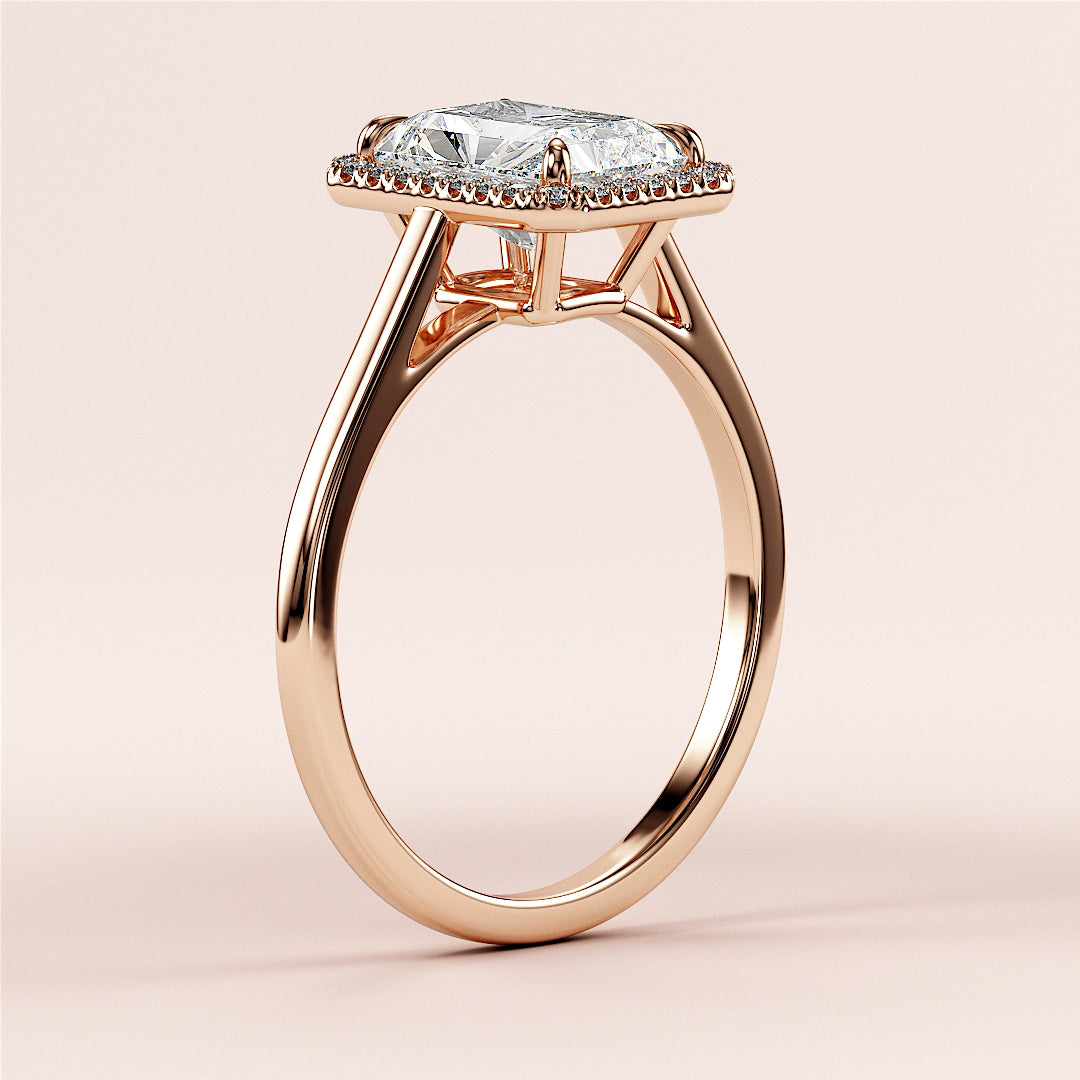 14K rose gold engagement ring with radiant-cut diamond, intricate cathedral setting, close-up on neutral background.|







#14KRecycledRoseGold
#18KRecycledRoseGold


