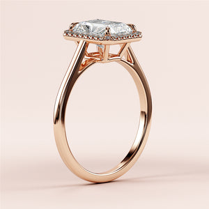 14K rose gold engagement ring with radiant-cut diamond, intricate cathedral setting, close-up on neutral background.