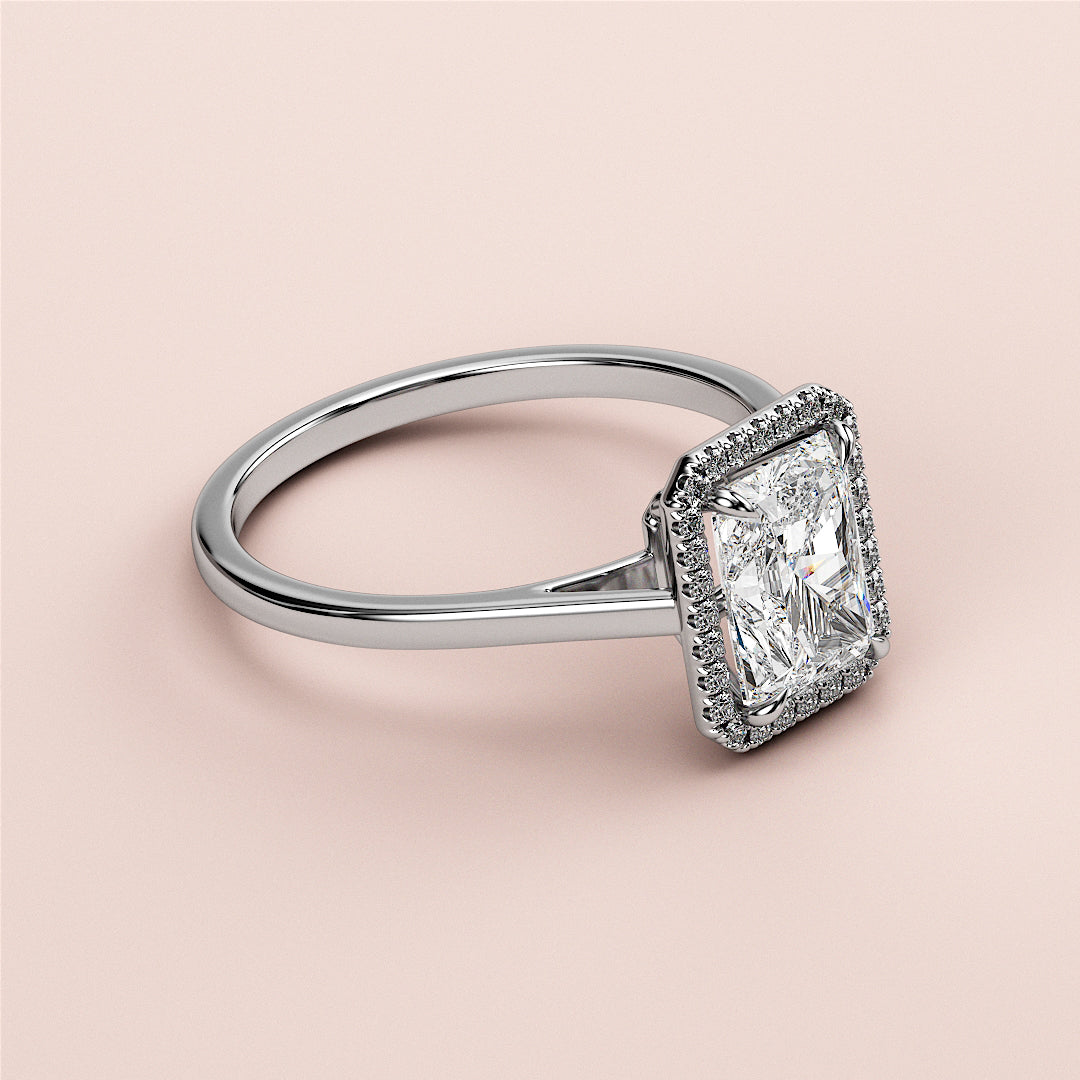 Elegant 14K/18K white gold engagement ring featuring a radiant-cut diamond in a halo setting, not worn on model.|

#14KRecycledWhiteGold
#18KRecycledWhiteGold








#Platinum