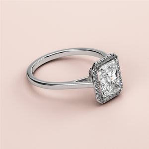 Elegant 14K/18K white gold engagement ring featuring a radiant-cut diamond in a halo setting, not worn on model.