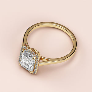 Radiant-cut diamond halo engagement ring in 14K or 18K gold or platinum, showcased on a neutral background.