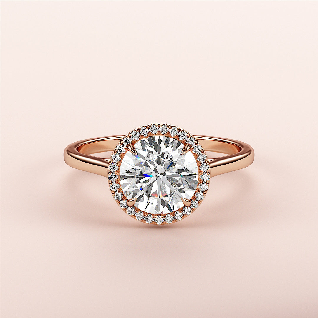 Elegant round halo diamond engagement ring in 14K or 18K rose gold, featuring a stunning halo of smaller diamonds.|







#14KRecycledRoseGold
#18KRecycledRoseGold


