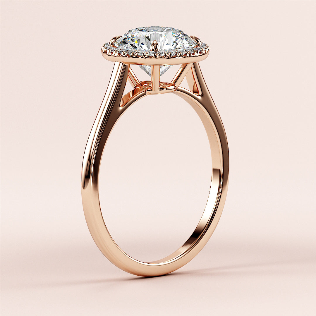 Elegant rose gold engagement ring with a round brilliant-cut diamond in a halo setting, crafted in 14K or 18K gold for timeless beauty.|







#14KRecycledRoseGold
#18KRecycledRoseGold


