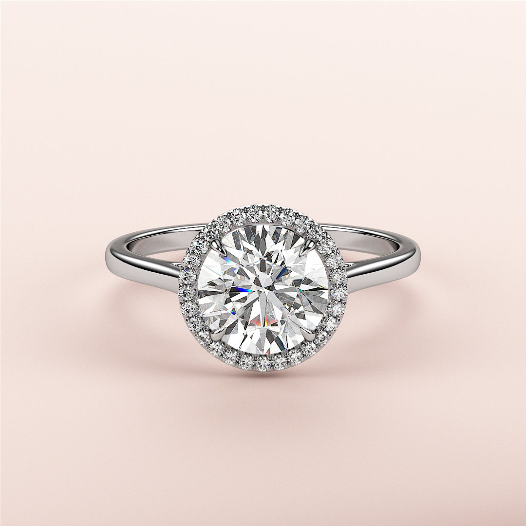 Elegant 14K or 18K gold or platinum engagement ring featuring a round-cut diamond halo, perfect for special occasions.|

#14KRecycledWhiteGold
#18KRecycledWhiteGold








#Platinum