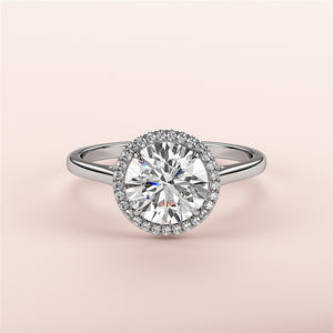 Elegant 14K or 18K gold or platinum engagement ring featuring a round-cut diamond halo, perfect for special occasions.