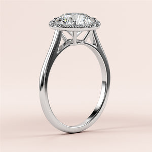 Elegant white gold round halo cathedral engagement ring featuring a brilliant diamond, available in 14K, 18K, or platinum.