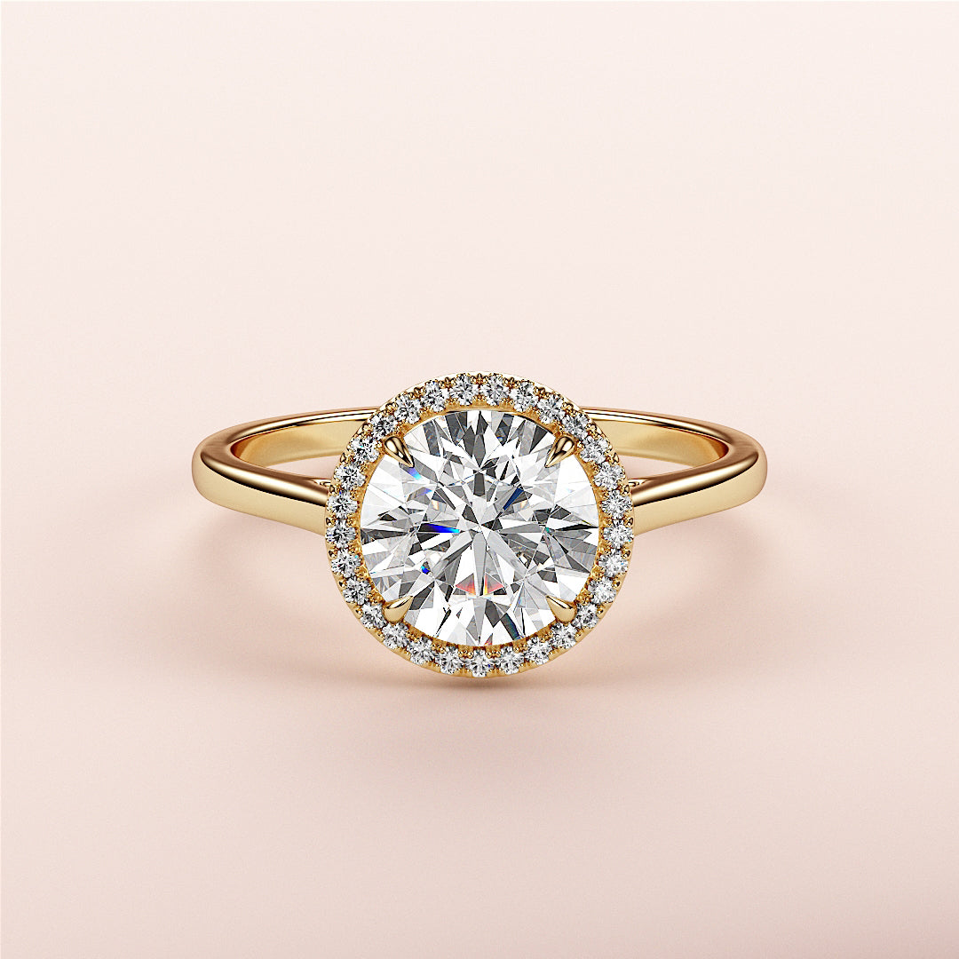 14K or 18K yellow gold engagement ring with round halo and cathedral band, featuring a diamond center stone, on pink background.|




#14KRecycledYellowGold
#18KRecycledYellowGold





