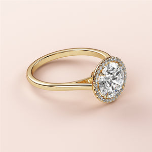 Elegant 14K yellow gold engagement ring featuring a round halo, set with diamonds for a timeless and luxurious look.