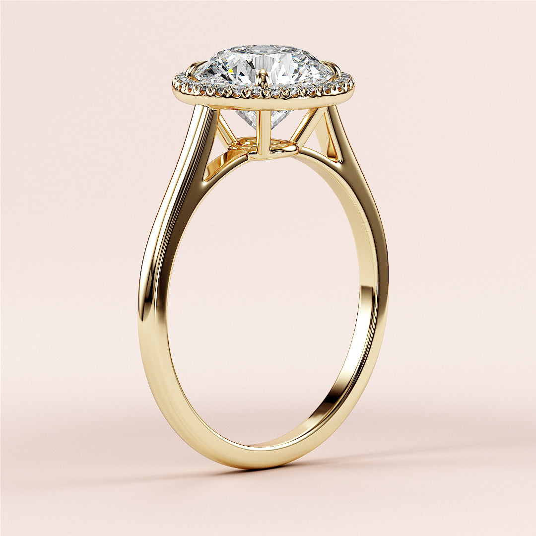 Elegant 14K yellow gold engagement ring with round diamond halo setting, featuring a sophisticated cathedral design.|




#14KRecycledYellowGold
#18KRecycledYellowGold





