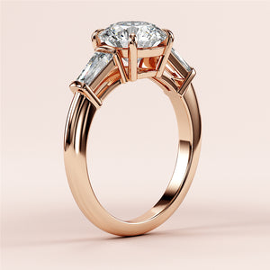 Elegant 14K/18K rose gold engagement ring with oval diamond center and tapered baguette side stones, perfect for your special moment.