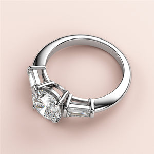 Elegant 14K white gold engagement ring with Asscher-cut diamond and tapered baguettes, perfect for special occasions. Not worn on model.