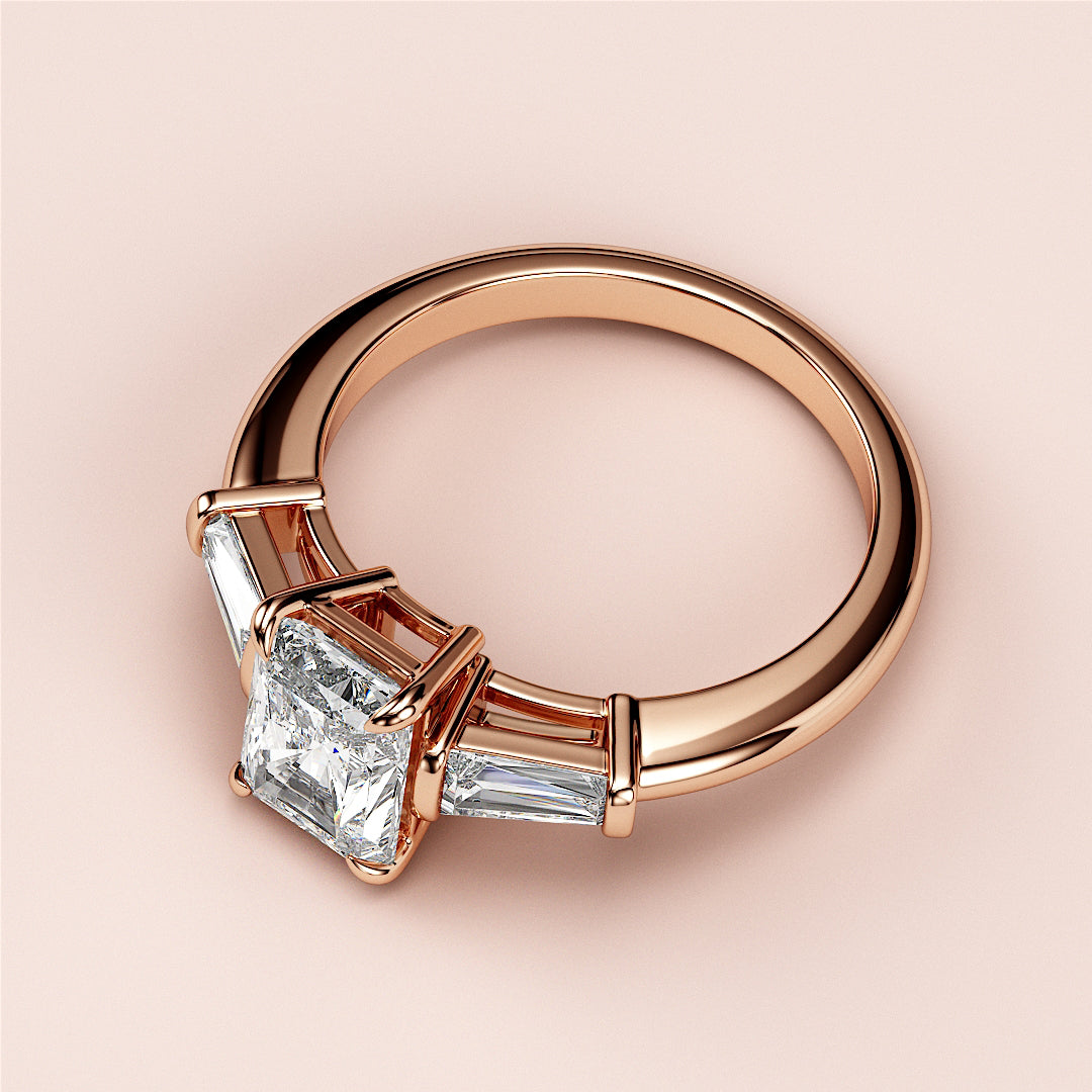 Elegant rose gold engagement ring with radiant-cut diamond and baguette accents, available in 14K, 18K, or platinum.