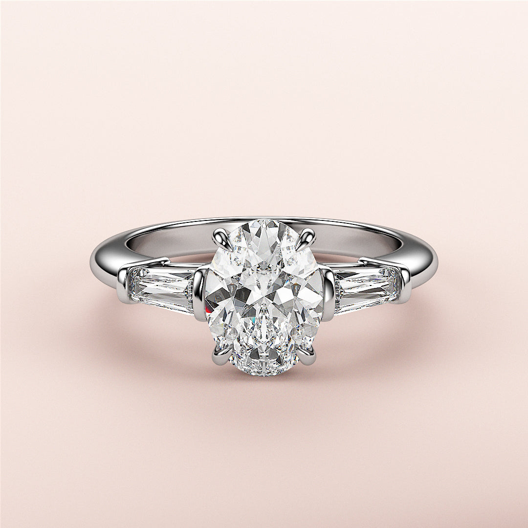 Stunning 14K white gold engagement ring featuring an oval diamond center and tapered baguette side stones, not worn on model.|

#14KRecycledWhiteGold
#18KRecycledWhiteGold








#Platinum