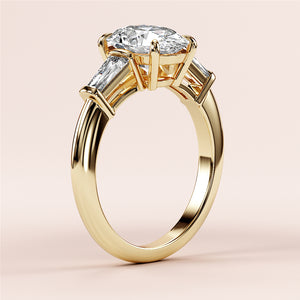 Elegant 14K or 18K yellow gold engagement ring featuring a marquise-cut diamond center and tapered baguette side diamonds.