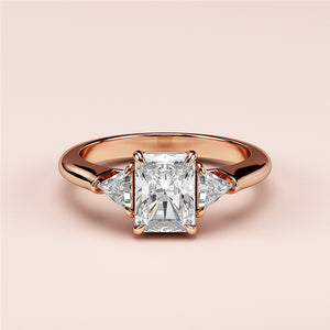 Elegant rose gold diamond engagement ring with radiant-cut center and triangular accents, available in 14K, 18K, or platinum.