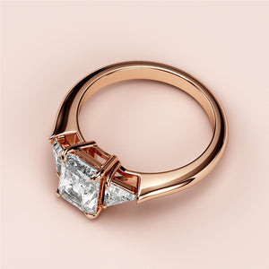 Elegant 14K rose gold engagement ring with a princess-cut diamond and trapezoid side diamonds, perfect for your special moment.