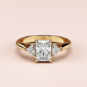 Elegant 14K yellow gold engagement ring featuring a radiant-cut diamond center stone and two trillion-cut side diamonds.
