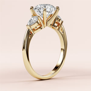 "Elegant 14K yellow gold engagement ring with oval-shaped diamond and two side diamonds, also available in 18K and platinum."