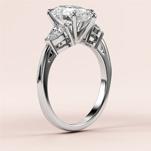 Elegant 14K and 18K white gold engagement ring with trilliant-cut diamond center and side diamonds, perfect for a timeless proposal.