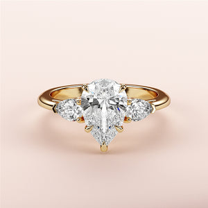 Elegant 14K/18K yellow gold engagement ring with pear-shaped diamond and side stones, perfect for a timeless proposal.