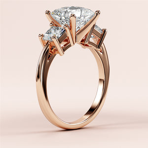 Elegant 14K rose gold engagement ring featuring an oval diamond center stone and two side diamonds for a timeless look.