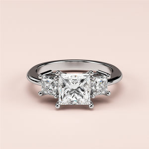 Elegant 14K or 18K gold three-stone engagement ring with a princess-cut center diamond and two side diamonds.