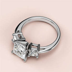 Elegant white gold three-stone princess-cut engagement ring with a central diamond, available in 14K, 18K, and platinum.