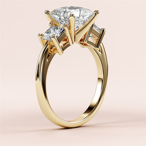 Elegant three-stone princess engagement ring in 14K gold, featuring an oval diamond centerpiece and surrounded by round diamonds.