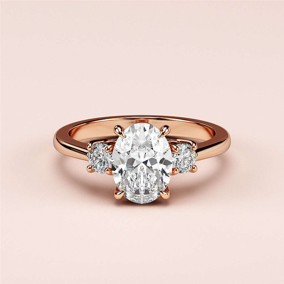 An elegant oval-shaped diamond engagement ring with side stones on a 14K or 18K rose gold or platinum band.|







#14KRecycledRoseGold
#18KRecycledRoseGold


