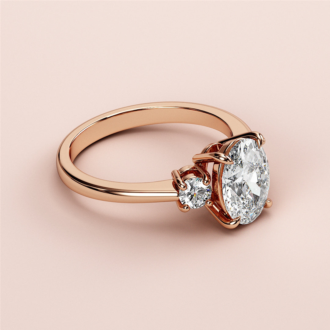 Elegant rose gold engagement ring with oval and round diamonds, available in 14K, 18K gold, or platinum. Timeless design.|







#14KRecycledRoseGold
#18KRecycledRoseGold


