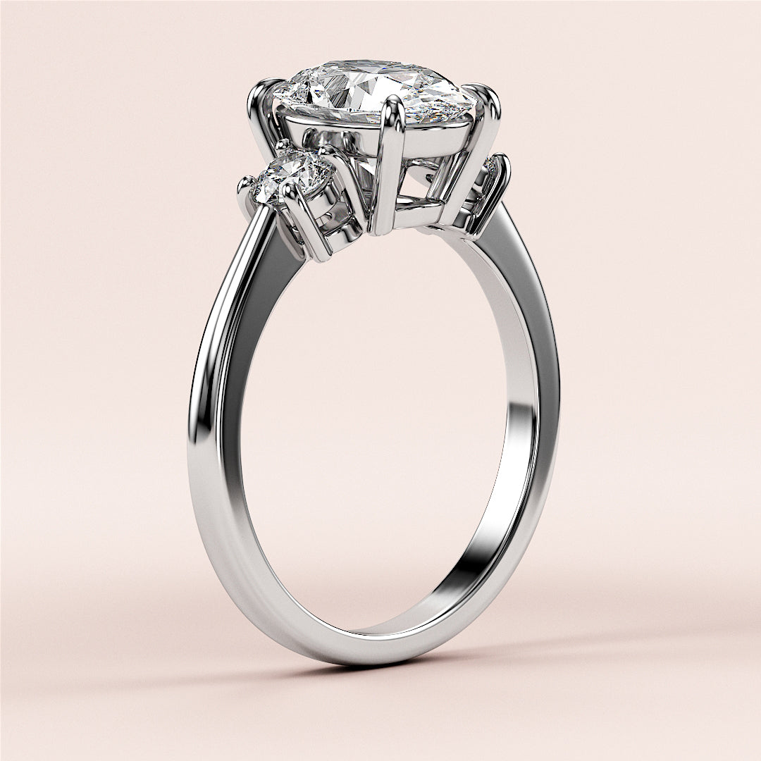 Elegant 14K or 18K white gold engagement ring featuring an oval center diamond and side stones, displayed on a neutral background.|

#14KRecycledWhiteGold
#18KRecycledWhiteGold








#Platinum