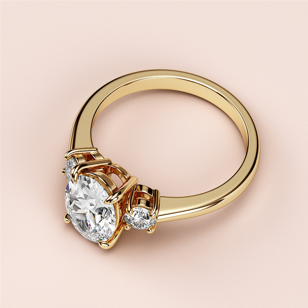 Elegant yellow gold engagement ring with round-cut diamond and accent diamonds, available in 14K or 18K gold.|




#14KRecycledYellowGold
#18KRecycledYellowGold





