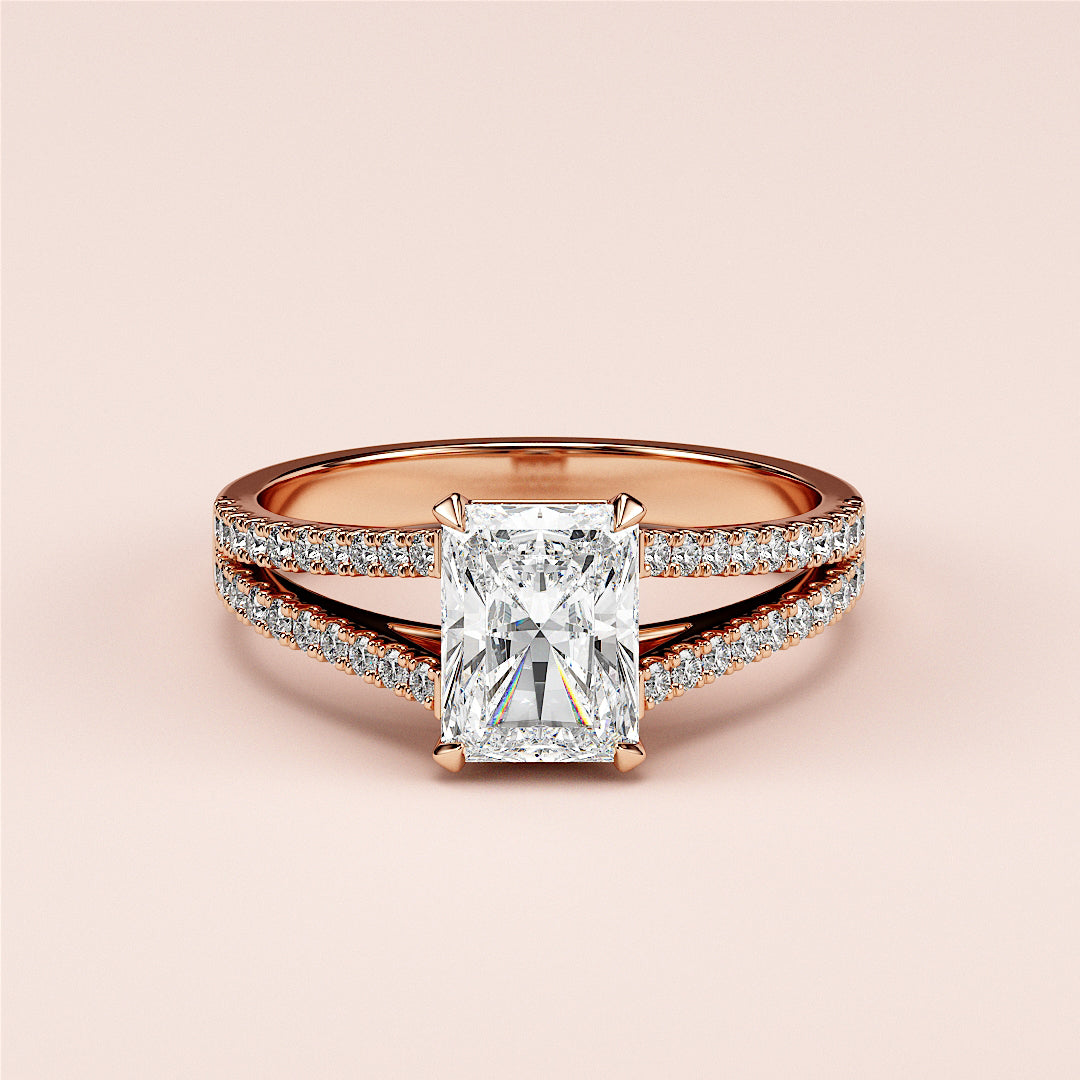 Elegant 14K rose gold engagement ring featuring a radiant-cut diamond in a split shank with pave-set diamonds, embodying timeless sophistication.|







#14KRecycledRoseGold
#18KRecycledRoseGold


