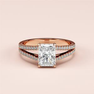 Elegant 14K rose gold engagement ring featuring a radiant-cut diamond in a split shank with pave-set diamonds, embodying timeless sophistication.