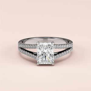 Exquisite radiant-cut diamond engagement ring on a pave band, available in 14K/18K white gold or platinum with split shank design.